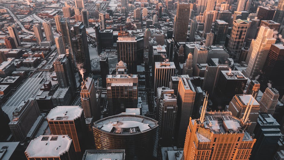Experience the breathtaking aerial view of Chicago's snow-dusted skyline captured in the evening light.